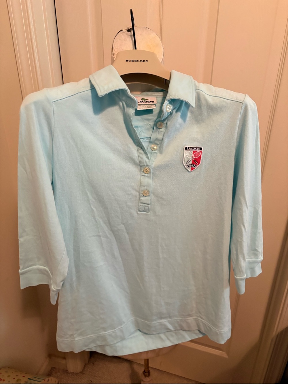 Lacoste women’s 40 3/4 sleeve Light Blue Polo Shirt with tennis Crest